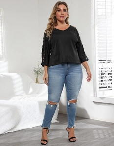 Detail of V-neck top showing hollow-out lattice sleeve design and casual bright setting