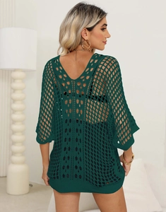 Detail of dark green crochet bikini cover-up with mesh knit and back V-neck design