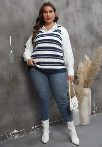 Chic women's blue and white striped knit vest styled with a crisp white long sleeve shirt