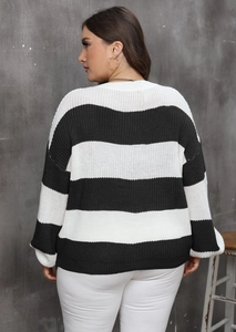 Back view of oversized knit sweater with classic black and white wide stripes pattern