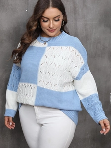 Detail of blue and white checkered knit sweater with cable knit and hollow out patterns