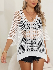 Close-up of white crochet hollow mesh cover-up featuring a deep V-neck and batwing sleeves