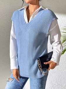Close-up of sky blue V-neck knit sweater vest featuring chunky textured stitch pattern