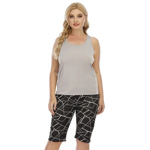 Detailed view of women's gray sleeveless tank top and geometric pattern workout shorts