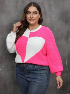 Detail of knit texture on pink and white plus size sweater with large heart pattern