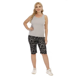 Detail of plus size casual set showing grey sleeveless top and geometric print shorts