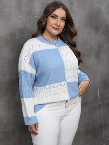 Detail of blue and white color-block knit sweater with intricate hollow texture