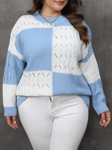 Detailed close-up of light blue and white checkered knit sweater with hollow out pattern