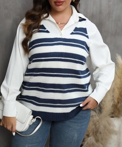Detail of navy blue striped knit vest layered over a white collar shirt and denim jeans