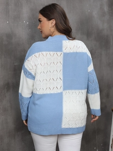Detail of color block knit sweater with blue and white check patterns and hollow out textures