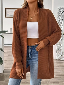 Close-up of the thick brown knit texture on this long-sleeved casual cardigan sweater