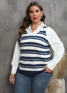 Detail of V-neck striped knit vest layered over a white long-sleeve shirt with necklace