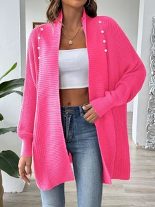 Bright pink knit cardigan with elegant pearl shoulder buttons and relaxed open-front design