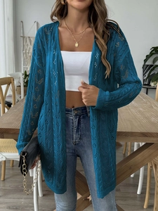 Detail of teal crochet hollow-out knit cardigan showing the pointelle texture and sleeves