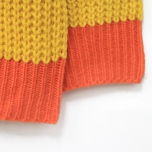 Women's color block striped cardigan with knit honeycomb texture and ribbed orange cuffs