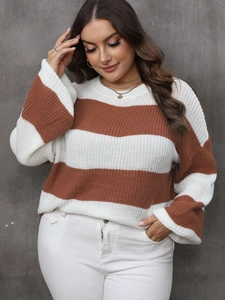 Detail of chunky knit striped sweater with white and caramel brown contrast stripes