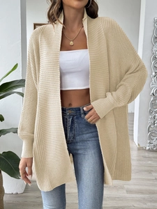 Women's chic beige oversized chunky knit cardigan sweater for casual autumn fashion style