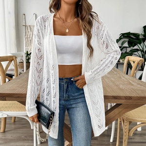 Close-up of white crochet hollow knit texture on a long-sleeve casual cardigan