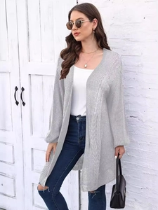 Women's light grey oversized knit cardigan with cable stitch and lantern sleeves