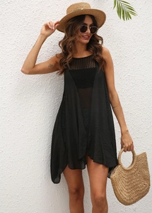 Detail of black crochet knit cover-up dress with hollow diamond pattern for beachwear