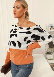 Detail of knit sweater with cow print splicing, orange hem and off-shoulder neckline