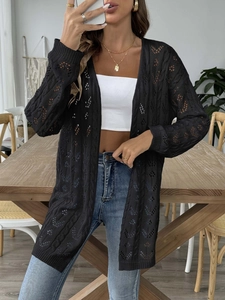 Women's black open knit cardigan featuring hollow out long sleeves and casual crochet design