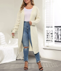 Cozy cream knit cardigan styled with distressed denim jeans for a casual daily outfit
