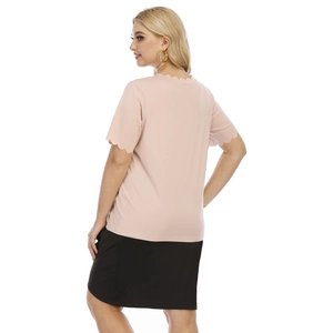 Plus size light pink t-shirt with scalloped edges and black skirt back view