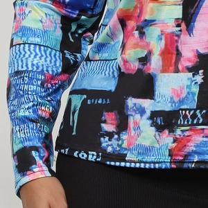 Detailed close-up showing the artistic abstract digital print and fine knit fabric texture