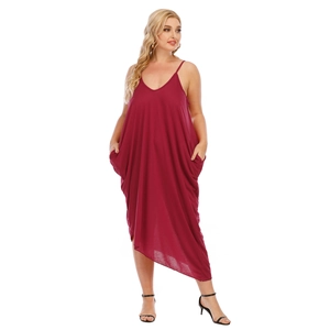 Detail view of plus size V-neck dress with hidden pockets and asymmetrical hemline