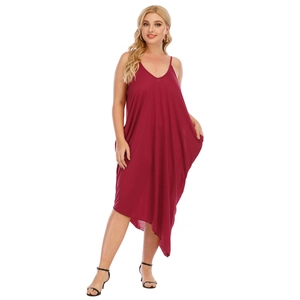 Detail view of burgundy V-neck plus size dress with irregular hem and side pockets