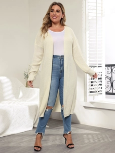 Detail of off-white long knit cardigan featuring an open front design and textured fabric