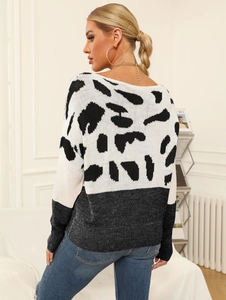 Detail of woman's knit sweater featuring leopard print splicing and a grey plain-knit back