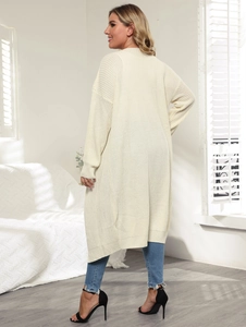 Detail view showing the full length and knit texture of an off-white long cardigan