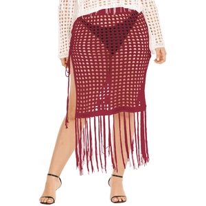 Detail of wine red crochet mesh skirt featuring side drawstring slit and long fringe trim