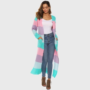 Detail shot of the chunky knit texture and colorful striped pattern on women's cardigan
