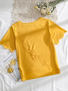 Bright yellow plus size cutout t-shirt with irregular hem and laser-cut floral details