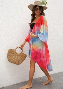 Detail of lightweight tie-dye beach cardigan with sheer mesh and vibrant flowy fabric