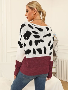 Rear view of a leopard print knit sweater with burgundy color-block panel design