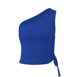 Detail of royal blue one-shoulder crop top featuring side drawstring ruching and tie