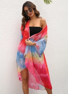 Tie-dye chiffon beach cover-up detail with vibrant pink, blue and yellow sheer fabric