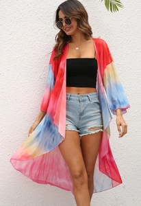 Detailed texture of tie-dye chiffon fabric on a flowy beach cover-up kimono