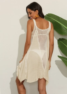 Close-up of crochet patchwork and hollow knit details on the back of beach dress
