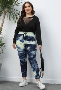 Close-up detail of black plus size long sleeve top with hollow-out triangular neckline design