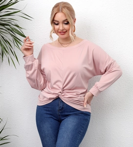 Detail view of twist knot hem on a mauve long-sleeve casual top for plus-size women