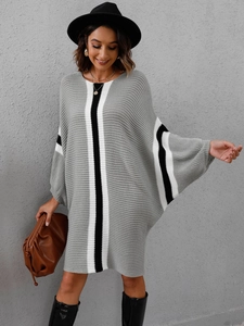 Detail of color block striped knit dress with loose batwing sleeves and round neck