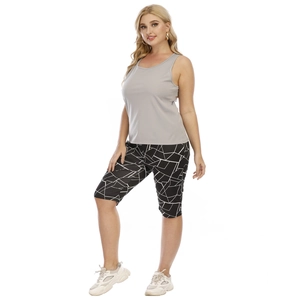 Detail of plus size high waist cycling shorts with black and white geometric pattern