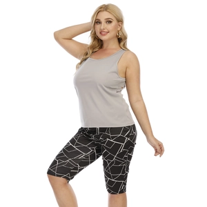 Women's plus size sports set with grey tank top and geometric print cycling shorts
