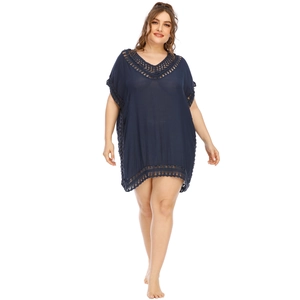 Detailed view of the navy blue crochet lace trim and textured fabric on beach cover-up dress