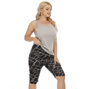 Women's plus size sports set with grey vest and geometric print cycling shorts